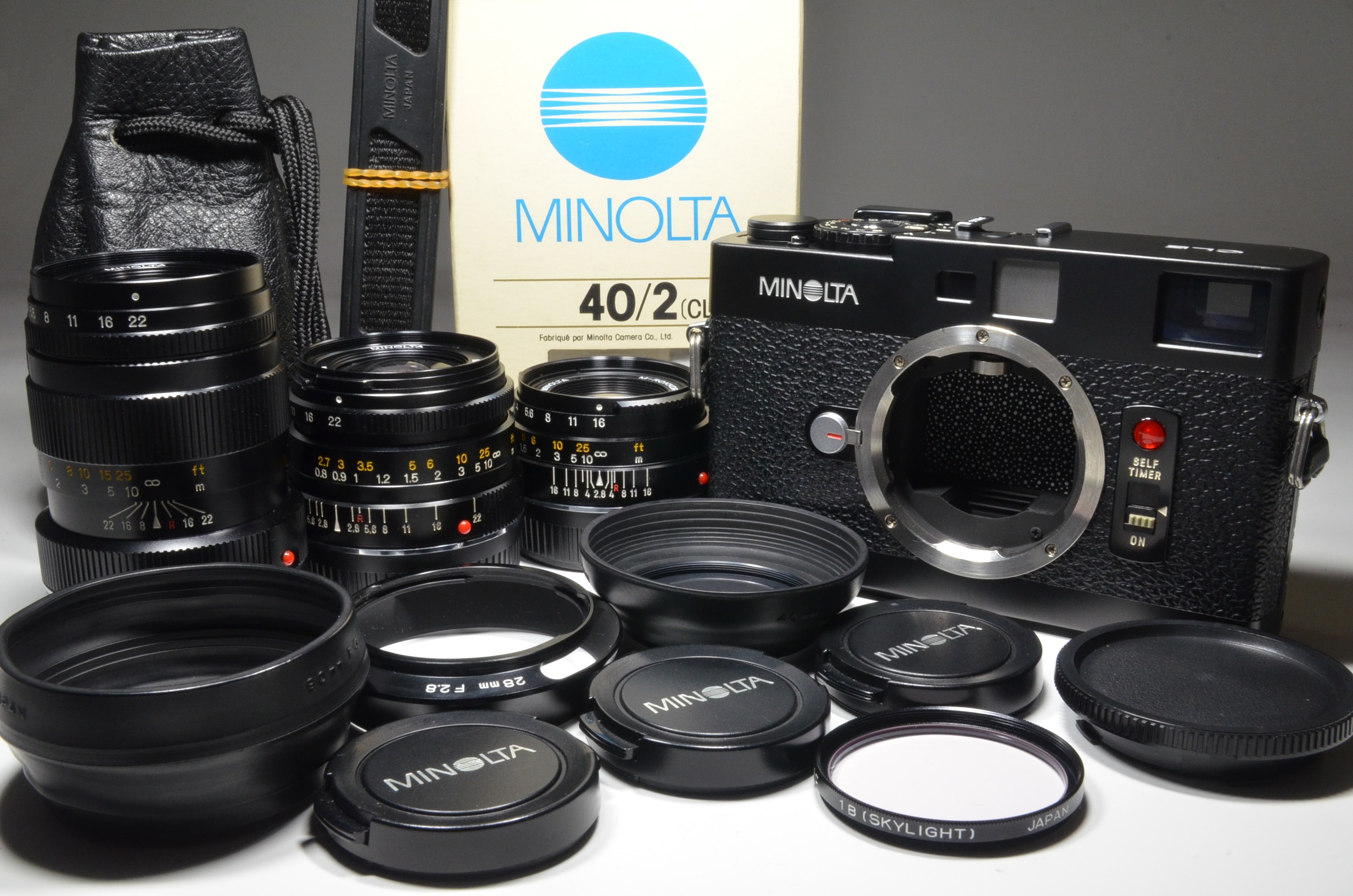 minolta cle film camera with 3 lenses m-rokkor 40mm f2, 28mm f2.8 and 90mm f4